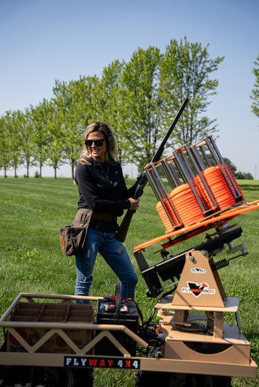 fly way 4x4 thrower with lady standing behind it